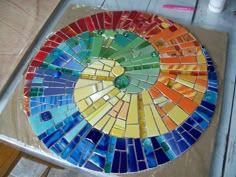 there is a colorful mosaic on the table