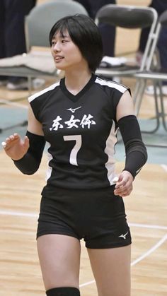 a female volleyball player in action on the court