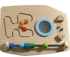 a wooden toy with various toys on it