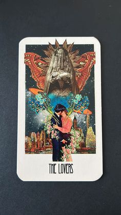 the lovers tarot card with an image of a man and woman hugging each other