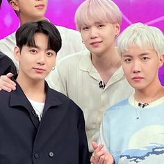 the members of btop are posing for a photo together in front of a purple background