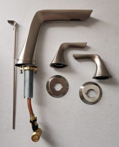 the faucet is attached to the wall with other parts