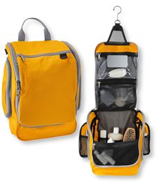 an open yellow travel bag with its contents in it's zippered compartment, and the other side is filled with toiletries