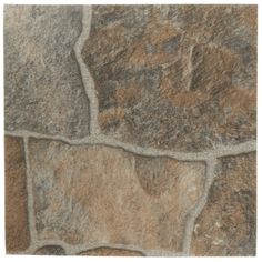 a close up view of a stone floor with brown and tan colors on it's surface