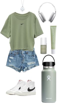 a woman's outfit with headphones, sneakers and a water bottle is shown