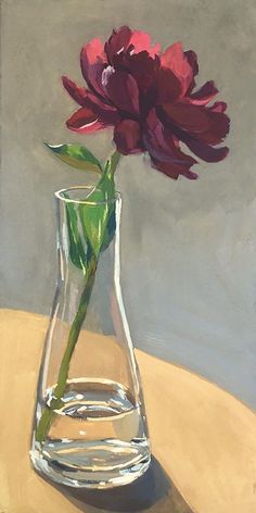 a painting of a red flower in a glass vase on a wooden table with water