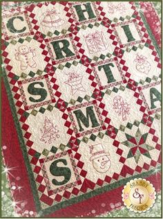 a red and green christmas quilt with the words santa's cribt on it