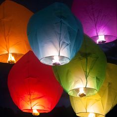 colorful lanterns lit up in the night sky