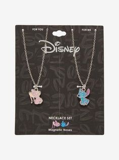 two disney necklaces with charms on them