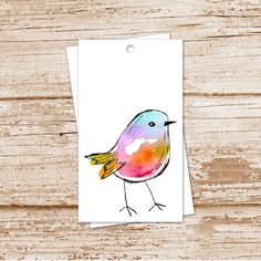 a card with a watercolor bird on it