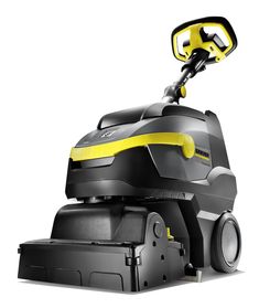 a black and yellow floor cleaner on a white background with no people around the machine