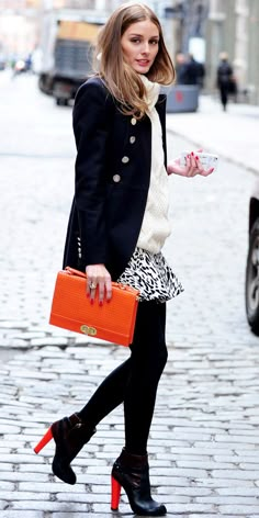 You can never go wrong with a printed skirt & opaque black tights | Olivia Palermo in NYC Orange Clutch, Estilo Olivia Palermo, Navy Pea Coat, Black And White Outfit, Olivia Palermo Style, Walking Down The Street, Fall Booties, Paris Mode, Animal Print Skirt