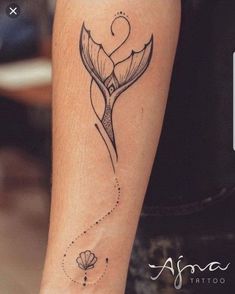 a woman's arm with a tattoo on it