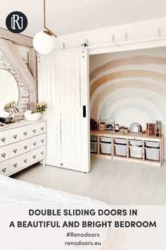 a bedroom with white furniture and walls painted in pastel tones, including an arched mirror