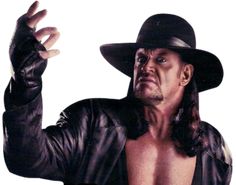 a man in a black hat and leather jacket holding his hand up to the side