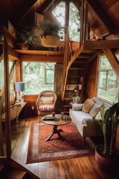 a living room filled with furniture and a spiral staircase leading up to the second floor