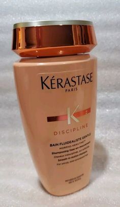 Kerastase Discipline Bain Fluidealiste Sulfate-Free Shampoo - 8.5 fl oz. Description KERASTASE DISCIPLINE BAIN FLUIDEALISTE Sulfate-FREE Smooth-in Motion Shampoo Kerastase Discipline Bain Fluidealiste Sulfate-Free is designed to protect your hair against frizz and humidity for up to 72 hours. This shampoo is more than just a simple cleanser, it will gently cleanse away impurities without weighing down the hair, whilst the pro-keratin formula restores and re-establishes the integrity of the hair. Kerastase Discipline Bain Fluidealiste Sulfate-Free is enriched with amino acids, a wheat protein derivative, and ceramide R, which smooths and strengthens the hair and creates an even surface and a hydrophobic layer that protects the hair from humidity. Your hair will be left with natural movement Kerastase Oily Hair, Kerastase Shampoo For Oily Hair, Kerastase Genesis Shampoo, Kerastase Nutritive, Simple Cleanser, Kerastase Shampoo, Kerastase Discipline, Smooth Shiny Hair, Sulfate Free