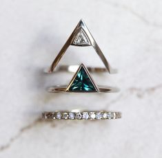 Frozen teal triangle shaped sapphire engagement ring. Buy wedding rings at affordable price from Capucinne Jewelry. Financing available. FREE shipping worldwide! Bff Rings, Engagement Ring Minimalist, Sapphire Wedding Ring, Sapphire Wedding Rings, Triangle Ring, Blue Green Sapphires, Sapphire Wedding, Etsy Wedding Rings, Sapphire Engagement Ring