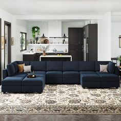 a living room filled with lots of furniture and decor on top of a large rug