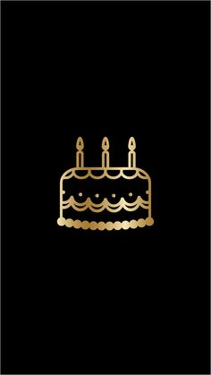 a cake with candles on it sitting in the middle of a black background and gold foil