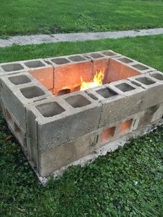 an outdoor fire pit made out of cinder blocks with the words awesome diy backyard fire pit