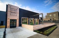 the outside of a bank building on a sunny day with blue skies in the background