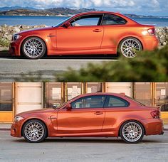 an orange car parked in front of a building next to another red car with chrome rims