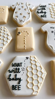 decorated cookies are arranged in the shape of hexagons and ones that say what will baby bee