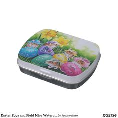 a tin with an image of some little fairy eggs in the grass and flowers on it