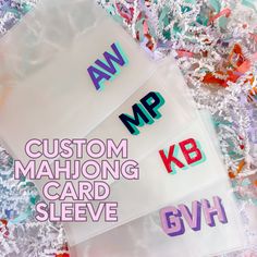 three stickers with the words custom mahlongg card sleeve and 6vh on them