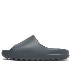 The adidas Yeezy Slide Slate Grey offers a lightweight and durable design. The color palette features a subtle yet versatile slate grey shade, making them suitable for various ensembles. With strategic cutouts and a breathable lining, these slides prioritize comfort. The outsole boasts a textured pattern for traction and stability. Perfect for casual wear or post-workout relaxation, these slides blend style and functionality seamlessly. The adidas Yeezy Slide Slate Grey is a collaborative creati Slippers Yeezy, Yzy Slides, Yeezy Boost 350 Outfit, Adidas Yeezy Slides, Grey Yeezy, Adidas Yeezy Slide, Yeezy Slides, Grey Sandals, Men Sandals