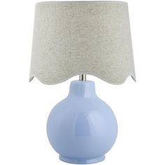 a light blue table lamp with a white shade on the base and a beige linen lampshade