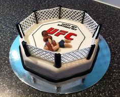 a birthday cake with a wrestling theme on it