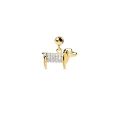 a pair of gold tone earrings with crystal stones in the shape of a dog, on a white background