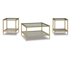 three tables with glass tops on each side and one shelf in the middle, all gold