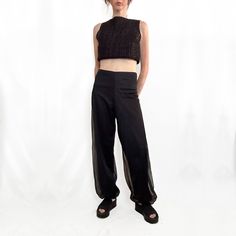 These true vintage black chiffon pants are perfect for Summer nights out. Likely made in the 70s from a lightweight, opaque nylon overlaid with a sheer chiffon nylon fabric, exuding a delicate and airy vibe. Featuring a high-waisted fit with slightly stretchy waistband these pants offer a sleek, smooth waist with relaxed, loose fit legs, tapering slightly toward gathered cuffs at the ankles, creating a romantic subtle blousy bubble effect. Blending vintage harem pant influences with a modern min Vintage Harem Pants, Chiffon Pants, Harem Pant, Black Chiffon, Womens Pants, Sheer Chiffon, Durham Nc, Nylon Fabric, Durham