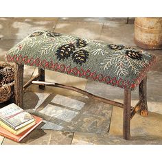 a bench with a book on the floor next to it and a basket full of books