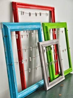 three frames with clothes pins attached to them