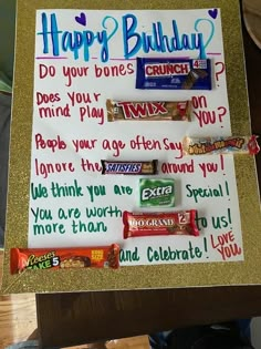 a birthday sign with candy bars on it