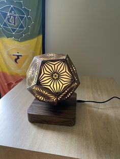 a wooden table with a lamp on it and a flag in the backround