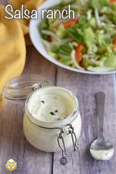 salad ranch in a jar next to a bowl of salad