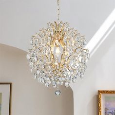 a chandelier hanging from the ceiling in a room