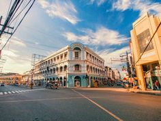 an old building on the corner of a street