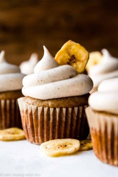 cupcakes with white frosting and banana slices