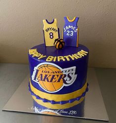 a birthday cake made to look like a lakers jersey