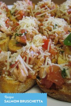 a white plate topped with slices of bread covered in toppings