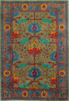 a green rug with red, blue and yellow flowers on the bottom is shown in an instagramtion