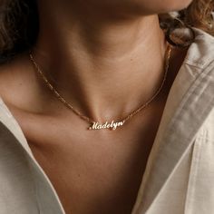 Our Carrie Name Necklace in Figaro Chain features a strikingly bold, yet minimal nameplate that hangs from a thick Figaro chain. The larger chain links lend this piece an effortlessly trendy and contemporary aesthetic. It's the perfect jewelry box addition to any modern, minimal style lover! • Material: High-Quality Solid 925 Sterling Silver• Dimensions: Depending on your font choice, height sizes range from 3mm to 4mm lowercase• Featuring High Quality 2mm Figaro Chain• Finish: Sterling Silver ∙ Modern Nameplate Necklace As Gift, Modern Nameplate Necklace For Gifts, Modern Nameplate Necklace For Gift, Modern Nameplate Necklace Gift, Modern Name Necklaces For Gifts, Modern Name Necklaces As Gifts, Delicate Custom Name Necklaces For Everyday, Delicate Everyday Custom Name Necklaces, Everyday Adjustable Nameplate Jewelry