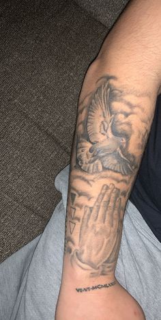 a man with a tattoo on his arm