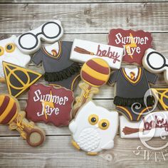 an image of some decorated cookies on top of a wooden table with the words summer love and harry potter